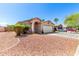Single-story home with low-maintenance landscaping and gravel, offering a clean and modern exterior at 8741 W Manzanita Dr, Peoria, AZ 85345