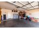 Spacious garage with ample storage and room for multiple bikes and home improvement supplies at 8741 W Manzanita Dr, Peoria, AZ 85345
