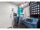 Well-organized laundry room with modern washer and dryer units at 8741 W Manzanita Dr, Peoria, AZ 85345