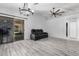 Bright, open living area with stylish floors, sliding glass doors, and minimalist decor, blending indoor and outdoor spaces at 8741 W Manzanita Dr, Peoria, AZ 85345