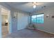 Bedroom featuring neutral colors, carpet, a window with mountain views, and a walk-in closet at 9443 E Mallory St, Mesa, AZ 85207