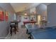 Spacious game room with a ping pong table, pool table, and bar for entertaining guests at 9443 E Mallory St, Mesa, AZ 85207