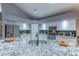 The kitchen is equipped with stainless steel appliances, granite countertops, and ample cabinet space at 9443 E Mallory St, Mesa, AZ 85207