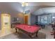 Open-concept living area with a pool table and ping pong table, perfect for recreation and gatherings at 9443 E Mallory St, Mesa, AZ 85207