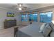 Main bedroom featuring neutral colors, a ceiling fan, backyard views and a wooden dresser at 9443 E Mallory St, Mesa, AZ 85207