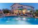 Inviting pool with lounge chairs, umbrellas and spa in backyard of home at 9443 E Mallory St, Mesa, AZ 85207