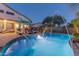 Sparkling pool with water features, sun loungers, and lush landscaping in the backyard at 9443 E Mallory St, Mesa, AZ 85207