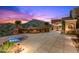 Serene backyard with a spa, fire pit, and covered patio, perfect for outdoor entertaining with mountain views at 9643 E Legacy Ridge Rd, Scottsdale, AZ 85262