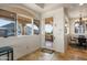 A breakfast nook showcasing a mountain view, tile flooring, chandelier and an arched window at 9643 E Legacy Ridge Rd, Scottsdale, AZ 85262