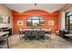 Dining room with colorful accent wall, large picture window with mountain views, and modern decor at 9643 E Legacy Ridge Rd, Scottsdale, AZ 85262