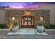 The property has a beautiful stone gate with lush planters that enhance its curb appeal at 9643 E Legacy Ridge Rd, Scottsdale, AZ 85262