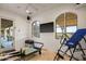 Well-lit exercise room with fitness equipment, tile flooring, and scenic views for an invigorating workout at 9643 E Legacy Ridge Rd, Scottsdale, AZ 85262