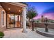 Home entrance with stone pillars, a water fountain, and desert mountain views in the background at 9643 E Legacy Ridge Rd, Scottsdale, AZ 85262