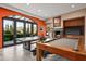 Game room featuring a pool table, ping pong table, fireplace, and access to the outdoors at 9643 E Legacy Ridge Rd, Scottsdale, AZ 85262