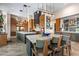 Large open kitchen, kitchen island and barstool seating with connecting access to wet bar at 9643 E Legacy Ridge Rd, Scottsdale, AZ 85262