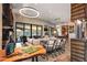 Open concept living space with modern decor, view of the outdoor space and a breakfast bar at 9643 E Legacy Ridge Rd, Scottsdale, AZ 85262