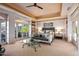 Spacious main bedroom with a seating area, large windows, and access to an outdoor balcony at 9643 E Legacy Ridge Rd, Scottsdale, AZ 85262