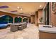 Outdoor kitchen with dining and lounge area plus a mountain view for serene relaxation at 9643 E Legacy Ridge Rd, Scottsdale, AZ 85262