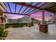 An outdoor patio featuring stone columns, pavers, pergola, and picturesque mountain views at 9643 E Legacy Ridge Rd, Scottsdale, AZ 85262