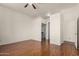Spacious bedroom features hardwood floors, access to a mirrored closet, and a connecting door at 9733 W Purdue Ave, Peoria, AZ 85345