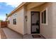 Front entry featuring a security door with decorative details and desert motif at 9733 W Purdue Ave, Peoria, AZ 85345