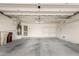 Interior of a garage with a water heater and storage shelving at 9733 W Purdue Ave, Peoria, AZ 85345