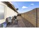 View of backyard showing the side yard and brick perimeter wall at 9954 W Mohawk Ln, Peoria, AZ 85382
