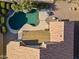 Aerial view of private backyard pool area with desert landscaping, diving board and relaxing lounge area at 9954 W Mohawk Ln, Peoria, AZ 85382