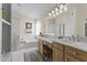 Well-lit bathroom with double sinks, a soaking tub, and a separate shower at 9954 W Mohawk Ln, Peoria, AZ 85382