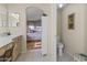 Bright bathroom featuring tile floors and providing entry to main bedroom at 9954 W Mohawk Ln, Peoria, AZ 85382