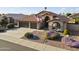 Charming single-Gathering home with a tile roof, manicured landscaping and a three-car garage at 9954 W Mohawk Ln, Peoria, AZ 85382