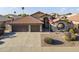 Charming single-story home with well-maintained landscaping, a two-car garage, and a classic Southwestern-style roof at 9954 W Mohawk Ln, Peoria, AZ 85382