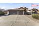 Driveway leads to a spacious two-car garage, perfect for parking and storage at 9954 W Mohawk Ln, Peoria, AZ 85382