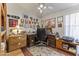 Functional home office featuring built in cabinets, a ceiling fan and carpet at 9954 W Mohawk Ln, Peoria, AZ 85382