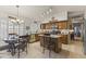 Charming kitchen featuring wood cabinets, stainless steel appliances, and an adjacent dining area at 9954 W Mohawk Ln, Peoria, AZ 85382
