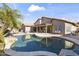 Aerial view showcasing the refreshing pool, extended patio, and serene backyard oasis at 9954 W Mohawk Ln, Peoria, AZ 85382