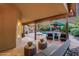 Gorgeous backyard offering outdoor lounge seating, a built-in barbecue, and lush landscaping at 10484 E Mission Ln, Scottsdale, AZ 85258