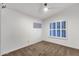 Bright bedroom with neutral carpet, a window with shutters, and ample natural light for relaxation at 10484 E Mission Ln, Scottsdale, AZ 85258