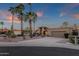 Single-Gathering home with desert landscaping, tall palm trees, and tile roof at 10484 E Mission Ln, Scottsdale, AZ 85258