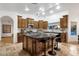 Large kitchen featuring custom wood cabinets, a granite-topped island, and high-end appliances at 10484 E Mission Ln, Scottsdale, AZ 85258