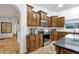 Gourmet kitchen with custom cabinets, stainless appliances, and black countertops at 10484 E Mission Ln, Scottsdale, AZ 85258