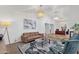 Bright living room featuring stylish seating, elegant lighting, and an open floor plan at 10484 E Mission Ln, Scottsdale, AZ 85258