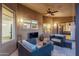 Relaxing outdoor patio area with comfortable seating and a ceiling fan for year-round enjoyment at 10484 E Mission Ln, Scottsdale, AZ 85258