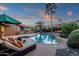 Inviting backyard pool with chaise lounges, lush landscaping, and a relaxing lounge area at 10484 E Mission Ln, Scottsdale, AZ 85258