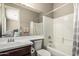 Bright bathroom featuring a combined shower and tub with a modern sink at 1078 W Redwood Ave, Queen Creek, AZ 85140