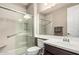 Updated bathroom featuring a glass shower door, new vanity, and modern fixtures at 1078 W Redwood Ave, Queen Creek, AZ 85140