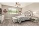 Serene bedroom showcasing a tufted headboard, soft lighting, and tasteful decor at 1078 W Redwood Ave, Queen Creek, AZ 85140