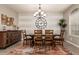 Dining room with a large chandelier, buffet and dining set at 1078 W Redwood Ave, Queen Creek, AZ 85140