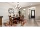 Dining room with a large wooden table and decorative rug at 1078 W Redwood Ave, Queen Creek, AZ 85140