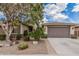 Charming single-story home features desert landscaping and a spacious two-car garage at 1078 W Redwood Ave, Queen Creek, AZ 85140